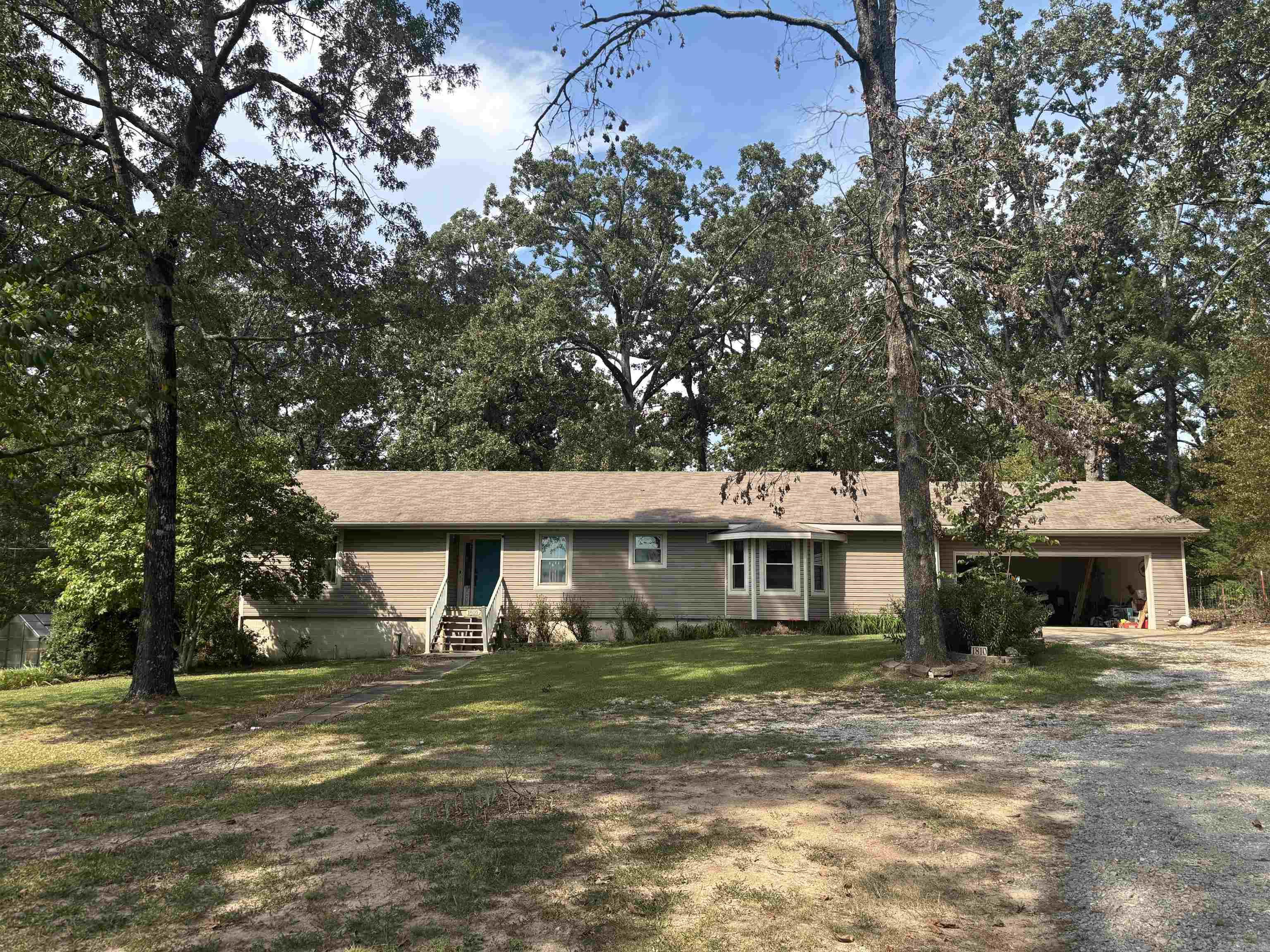 This home is surrounded by woods!! Has 30 x 60 mental building and 30 x30 barn. Great room has wood burning fireplace. Has office and a second living area that can also be a 4th bedroom. . All Electric, natural gas is available. Kitchen new dishwasher, Jen air range and pantry cabinet. Primary bedroom walk in closet. has large shower. Other two bedrooms share bathroom. Covered back porch, under house has work area or storage. Has RV 50 amp and generator 30 amp hookup at end of house. Roof is 10yrs old, has all new windows. New siding and gutters in 2018