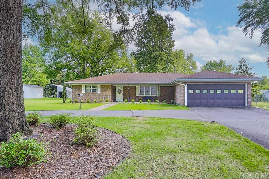 This amazing house was built as a VA home and is handicapped accessible.  Extra wide doors as well as no steps! Surrounded by mature pecan trees, this 2 acre property is in the perfect location near everything you might need. Walking distance from Bryant High School, shops, and so much more. This cozy one level home offers two living spaces with an updated kitchen/dining combination.  The kitchen offers stainless steel appliances, granite countertops, and plenty of counter space. Two multi-purpose rooms offer the perfect opportunity to have a large laundry room! Every bedroom is large offering plentiful closet space. Both full baths have been updated. The beautiful screened-in porch offering the perfect opportunity for family gatherings over-looking the large fenced-in back yard and beyond. 6 Foot privacy fence on two sides with a chain-link fence across the back offering amazing views of your land! Large two car garage offers plenty of storage and circle drive is perfect for guests! Don't miss this amazing opportunity!!  Recent updates:  Leaf guards on all gutters Sprinkler system in front yard Roof: 2016 Furnace: 2009 or 2010