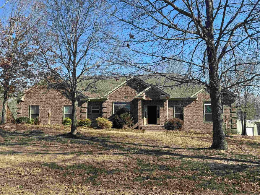Beautiful 3BR/2.5BA home with split bedroom floor plan situated on 3 acres with a small pond on a quiet dead end road.  Spacious living room features a wood burning stove for cozy evenings.  The primary suite offers his and hers closets, a large soaking tub and a separate shower with dual shower heads.  Recent updates include new wooden cabinets, fresh paint and new flooring in common areas and the primary bedroom.  Granite countertops throughout. Step outside to relax under the private pergola with hot tub just off the back deck, perfect for unwinding and enjoying the peaceful surroundings and wildlife.  Property also includes a 30x50 insulated shop with RV cover, offering ample space for storage, hobbies or equipment. New roof and HVAC in 2022. Peaceful country living with room to spread out!  Agents, see remarks.