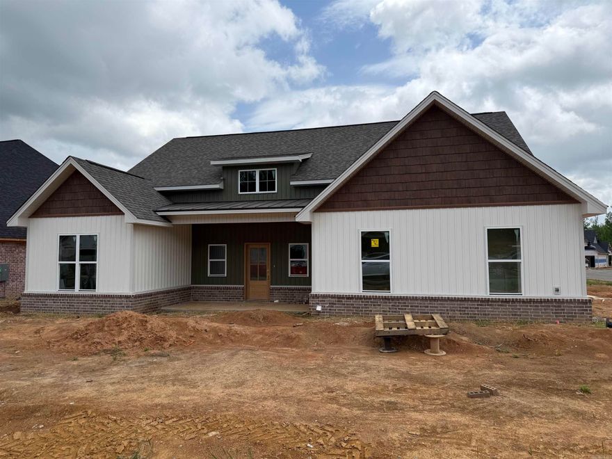 This new construction home on a corner lot in Creekside offers the perfect blend of traditional charm and modern style. Thoughtful details like accent walls, custom trim, vaulted ceilings, and high-end finishes create a bright, welcoming feel throughout. The open layout centers around a beautiful kitchen with custom cabinetry, stylish countertops, and a gas range, flowing seamlessly into the living room with a cozy gas fireplace. The split floor plan provides privacy, with a conveniently located half bath for guests. Enjoy the covered back patio and side-entry garage.