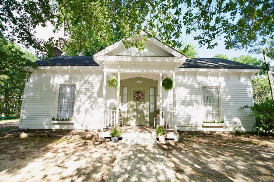 This charming historic home has lots of character. 2 bedroom 1 bath  with original hardwood floors throughout, large living area with wood burning stove, eat-in kitchen, sunroom, large deck to sit and enjoy the outdoors, camper/rv spot with water & electric that you could possibly rent out. Picnic & bonfire area, shed/chicken coop with nesting boxes, wet weather pond, large garden area, partially fenced, with pecan trees. Fun facts: Home is on the National Historic Registry & Some civil war relics were found on the property. Home has new stove.  Fridge and some furniture could stay with house.   All this sitting on 1.25 acres. Come see this one today!