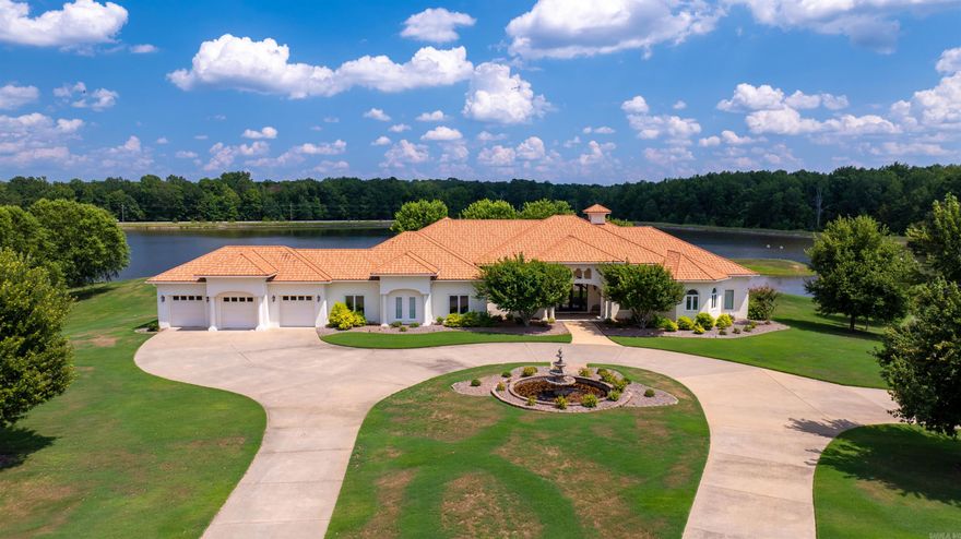 Welcome to 5300 Pleasant Lake Drive. With too many features to list here, one has to see this home to believe it. This stunning 6,000+ sqft estate offers luxury living all on one level, with over 2,000 sqft of covered porch. The home features a seamless flow between the dining, bar, formal living room, kitchen, and living room, creating a spacious yet defined layout. The expansive primary suite includes a large bedroom with lake views, a home gym, and a 12x14 walk-in closet with an island and hidden safe room. The suite's bathroom boasts separate vanities, a jetted tub, heated floors, and a wraparound shower. Three additional ensuite bedrooms each have walk-in closets and tiled showers or tub/shower combos. An elegant home office overlooks the lake. The gourmet kitchen features double islands, a KitchenAid range, wall oven, and a large pantry with an additional fridge. The oversized 3-car garage includes built-in cabinets, a storm shelter, and a washer/dryer. Enjoy the outdoor kitchen, fireplace, and lake views. The property also includes a 1,000 sqft guest house, a 1,600 sqft shop, and additional building potential with access from Pleasant Lake Dr. See assoc docs & agent remarks.