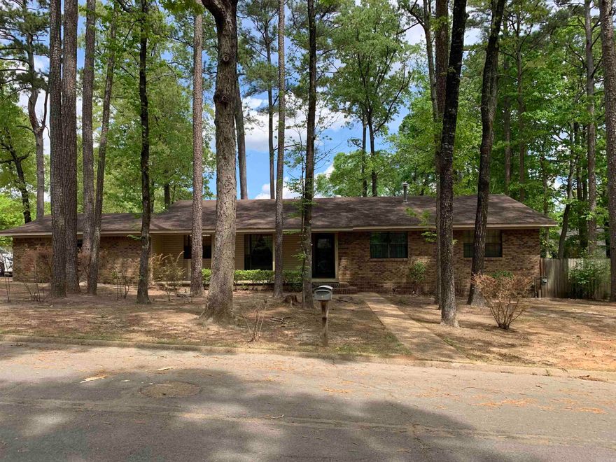 Welcome to your dream home! This stunning 4 bedroom, 3 bathroom brick residence is situation in a highly sough-after neighborhood.  Enjoy a spacious living area, including 2 family rooms, one featuring a cozy fireplace made of stone with surrounding built in bookcase, ideal for gatherings and relaxation.  A well-equipped kitchen with a breakfast area that flows seamlessly into the formal dining room, perfect for both casual meals and special occasions. Tile floors in the kitchen, breakfast room and laundry.  Generously sized bedrooms with ample closet space. The primary bedroom boasts his and hers closets, and en suite with double vanities, and a walk-in shower.  The third bathroom with walk-in shower is conveniently located off the laundry are adding practicality to your daily routine.  Access the expansive covered patio from both the family room and the primary bedroom, providing a perfect space for outdoor entertainment and relaxation.  A double garage ensures plenty of storage and parking space. There is a separate concrete driveway on the side of the house, which is a great space for RB entry and parking.   **SELLER TO RETAIN MINERAL RIGHTS TO THE PROPERTY.