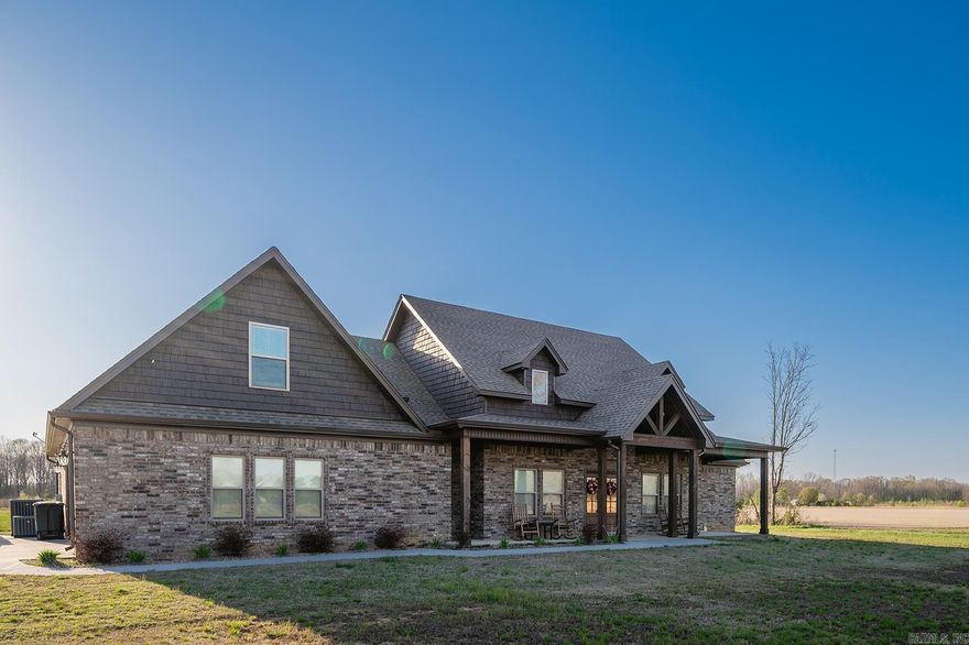 Nestled quietly on 10 acres, this stunning home built in 2022 offers the perfect blend of modern luxury and peaceful country living. With over 2800 sq. ft. of open-concept space, this home is ideal for those who love to entertain or simply enjoy the beauty of a spacious and comfortable retreat. Warm wood beams throughout the living room, cozy gas fireplace with built-in surrounds, huge kitchen island overlooking the living and dining areas, expansive cabinetry that reaches the ceiling, plus a large walk-in pantry, gas range with double ovens, perfect for family gatherings, split floor plan for added privacy, upstairs bedroom/bonus room with its own private bath, guest bedrooms downstairs with a jack-and-jill bath, the primary suite is a true retreat: spacious bedroom, bathroom, and closet that leads directly into the laundry room, luxurious primary bath with a large soaker tub, tiled walk-in shower, and double vanities The covered patio, complete with a wood-burning fireplace, is the perfect spot to unwind while taking in the serene surroundings. Need extra space? The large shop with electricity is also wired for a split unit and whole house generator for home. Your own paradise!