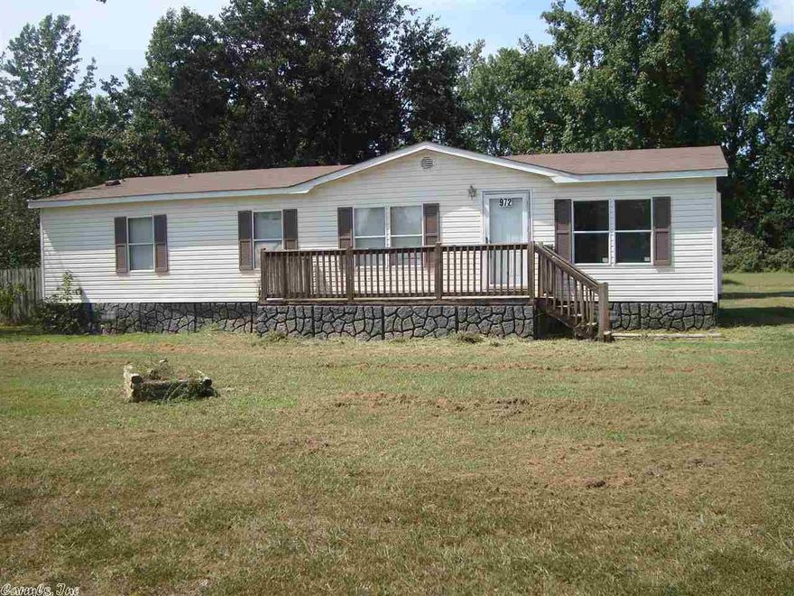 This home sits on 1 acre lot with country setting, but minutes from shopping. Kitchen has lots of counter space & a breakfast area. Living & dining room are open. Master bedroom has large closet. Master bath has double vanity, large tub & separate shower. New roof in 2001 & pole barn with lots of storage space in back. Double covered parking. Seller will install permanent foundation upon offer. Sq. Ft. approx. measuring encouraged. See Agent Remarks!