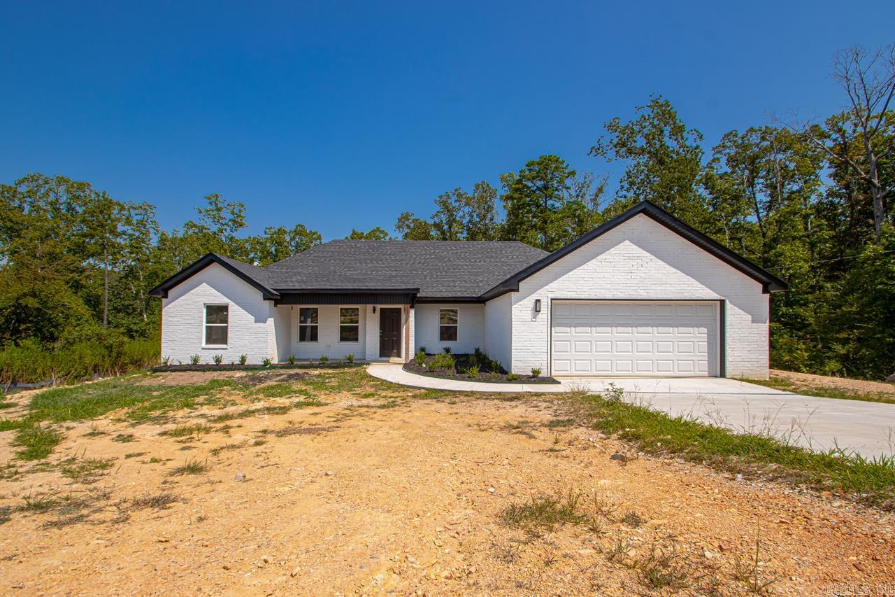 Beautiful brand-new construction on 3.27 acres, just minutes from Highway 70. This all-brick home offers 3 bedrooms, 2 bathrooms, a desirable split floor plan, and vaulted ceilings in the living room. The spacious kitchen features stainless steel appliances, a stainless apron-front sink, and plenty of room for cooking and gathering. Enjoy peaceful country living with a covered back porch, perfect for relaxing or entertaining. **Sod installation or credit to be given.