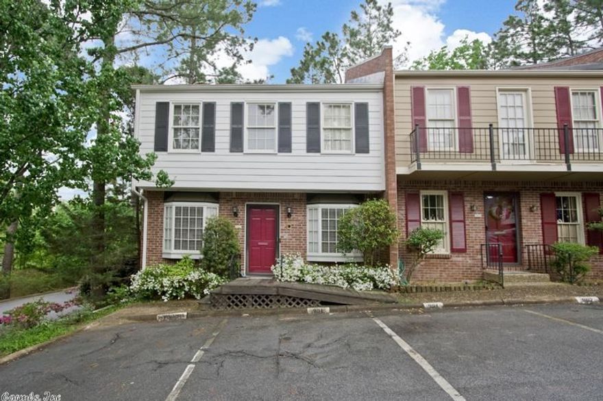 Renovated end unit condo has new slab granite counter top & new backsplash, new hand scrapped hardwood floor down stairs, new carpet upstairs is excellent quality, new paint throughout, new faucets, beveled glass leaded windows in liv/din rm from historic home in Quapaw Qtr.  New fence around patio.  Just move in!