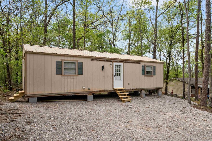 Great opportunity to own a cozy one-bedroom, one-bath home just minutes from Lake Hamilton. Perfect for investors or weekend getaway. Water and electric on site (not currently connected). With a little vison, this home could be transformed into a great income producing property. Don't miss your chance to invest!