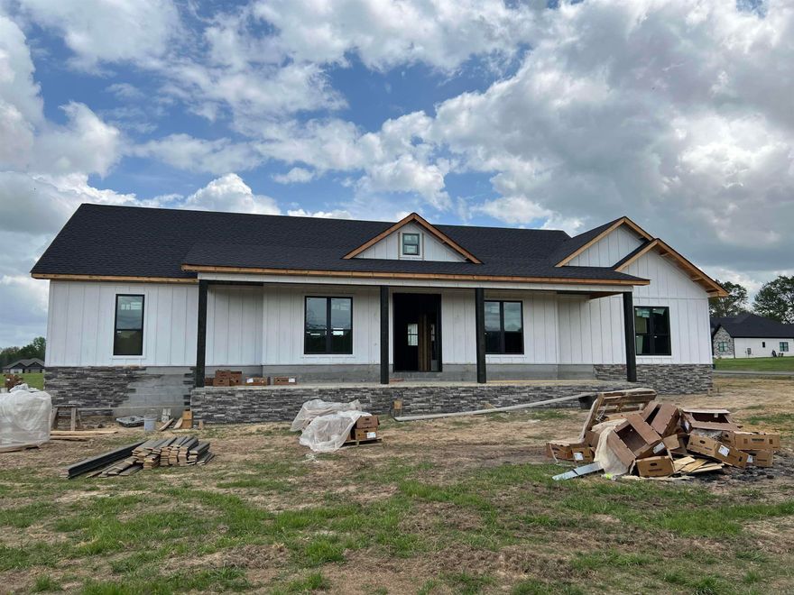 Brand new and sitting on 1.5 acres, this 4-bedroom, 2.5-bath home offers space, style, and functionality on a prime corner lot. The open floor plan features a welcoming living room with fireplace and a well-designed kitchen with island and butler’s pantry. The primary suite includes double sinks, a custom tile shower, soaker tub, and a walk-in closet that conveniently connects to the laundry room. Spacious guest bedrooms offer great closet space, while the covered back porch overlooks the huge backyard—perfect for relaxing or entertaining. Complete with a 3-car garage, this home checks all the boxes.