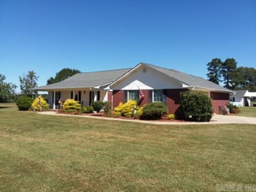 3 bedroom, 2 bath ranch style home with great curb appeal. The front porch area is beautifully landscaped at the entry of the home. The home sits on a huge lot of new oak trees, bradford pear, holly, apple trees and crepe myrtles on the front along the driveway. This 3.712 acre property is fully fenced. It has an apartment living area attached to shop, and additional parking. The bedrooms are amply sized with large closets. The family room is comfortable and open to the kitchen and breakfast area. Out back, you are greeted by a large porch with a swing and a sidewalk leading to the guest area. The gazebo out back has a built-in outdoor kitchen, and there is a fire pit area next to it.