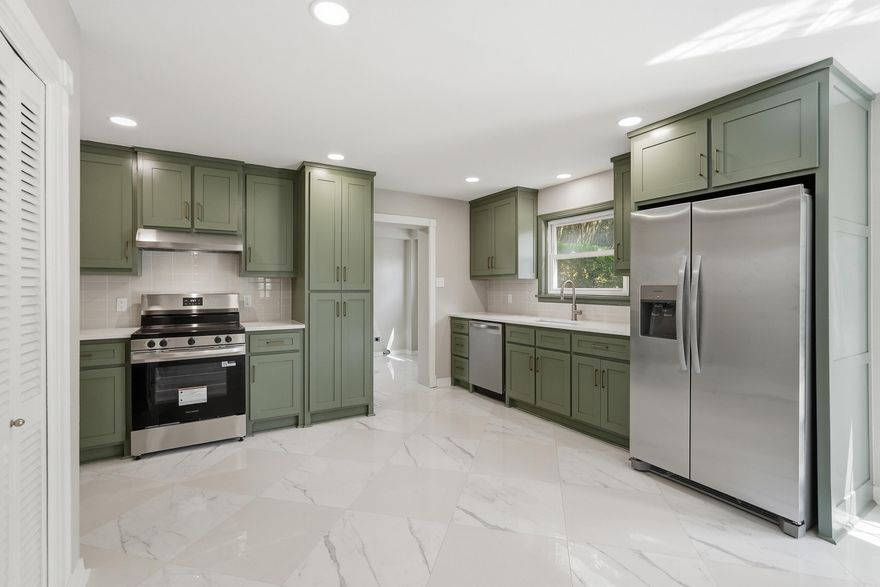 This stunning 4-bedroom, 3.5 bath home features both a formal living room and a spacious family room. Enjoy a separate dining room and a fully renovated kitchen with quartz countertops, brand new appliances, and custom cabinetry. Every bathroom has been updated with new vanities, countertops, and tile. With tons of windows, this home is filled with beautiful natural light in every room. You'll love the two-car garage, extra parking, and a large back patio perfect for relaxing or hosting.