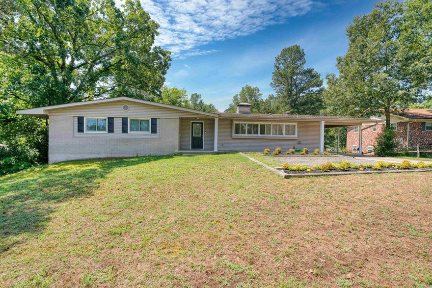 BIG PRICE DROP - Better Act Fast! Upstairs or Downstairs - YOU take your pick, in this family friendly Lakeside Area Home.  Walk-in level features 3 Bedrooms, 2 Baths, Living Room, Bright and Open Kitchen, Separate Dining Room, plus Breakfast Room. Lower level:  2 Bedrooms  separated by 1 Bath and massive den with wood burning fireplace, giant laundry room has space galore for fridge/freezer - you name it, plus there is an  amazing storage area or workshop space and the huge deck overlooks the large backyard.  This home is ready for you, all your crew, and your personal touches.