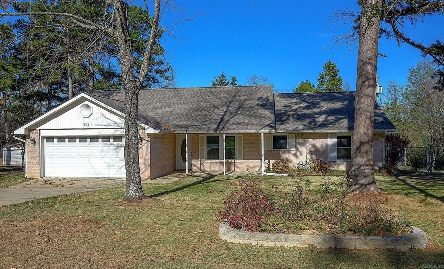 This beautifully updated, move-in ready home sits on just over half an acre in one of Mena's desirable neighborhoods. Step inside to find a bright, open floor plan centered around a stunning see-through fireplace that connects the living & dining areas, perfect for cozy evenings or entertaining guests. Updated kitchen showcasing granite countertops, stone backsplash, stainless steel appliances including a gas range/double oven combo, microwave & fridge. Primary suite features a low-threshold step-in shower. Guest bath features an extra-deep soaking tub. Both bathrooms tastefully remodeled with granite countertops & contemporary fixtures. Upgrades include a new roof (2024) & a Lennox super high-efficiency heat pump, ensuring comfort & energy savings year-round. Enjoy peaceful mornings & relaxing evenings on the covered patio overlooking the spacious, fully fenced backyard where wildlife frequent! Attached two car garage with built-ins. Cement slab w/covered (16x30) parking. She-shed w/small wood stove. Shop has electric, heat & air.  In addition to city water, the property offers a water well, great for watering the raised garden beds, flowering trees & pretty landscaping.