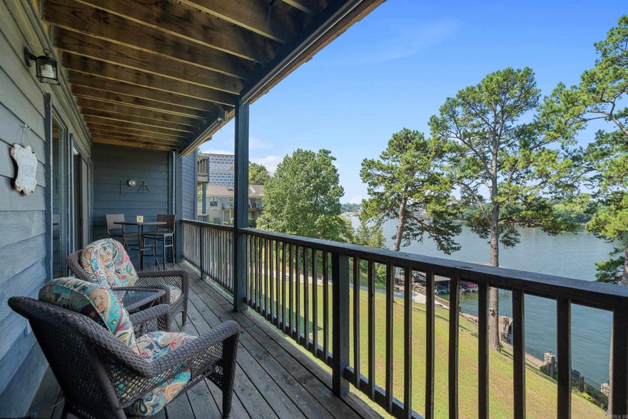 "Discover the ultimate lakeside retreat at this turnkey condo off Hwy 70 West in Hot Springs, AR. Boasting a covered boat slip with lift and the option for nightly rentals, this property is a lucrative investment opportunity. Ideal for discerning buyers seeking a luxurious escape, this beautifully updated condo features renovated baths a new walk in shower, a modern kitchen with top-of-the-line appliances (including wine frig), fresh soothing paint, and stylish lighting throughout. Also in demand this ground level walk in entry comes in to a big open water main channel breathtaking view from your private balcony. Sold fully furnished with a stunning sleeper sectional and tasteful decor and local art, this home is ready to impress. Enjoy breathtaking main channel big water views from your private balcony, along with a custom UV sun blocking shade, while the deep waters below offer excellent fishing opportunities and views. Don't miss out on this rare gem, complete with a covered boat slip and lift for your convenience. Enjoy much sought after covered parking, along with an additional parking space by the front door. Live the lake life in style at this exquisite Lake Hamilton condo."
