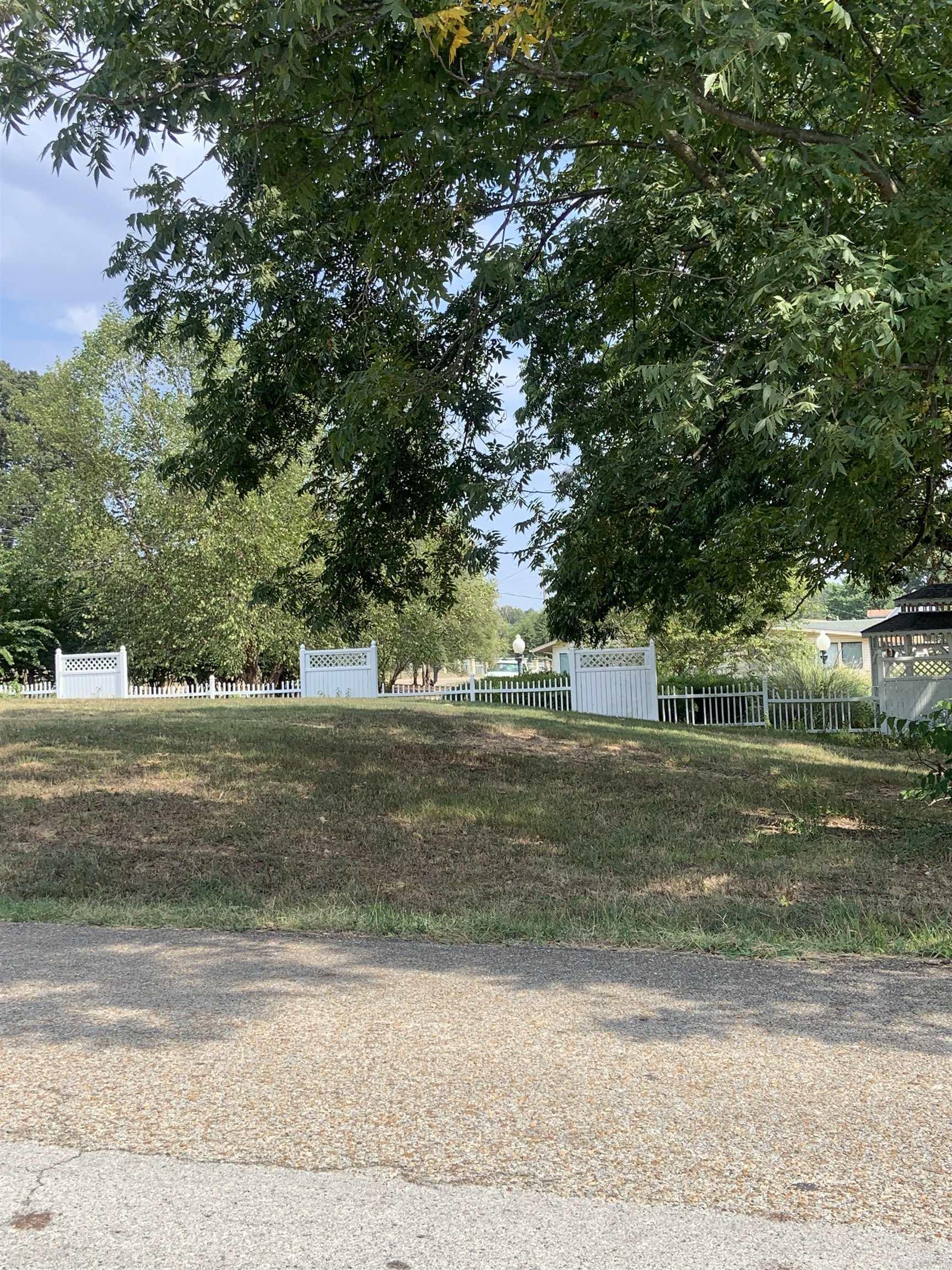Nice sloping lot on the Corner of Highway 412 West and Honeysuckle. Zoned R-! County Data reflects property to be .44 Acre. No Property Disclosures. City utilities available, not on property