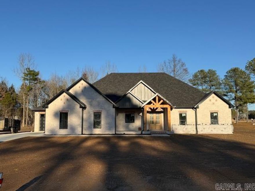 This one has fantastic curb appeal! This home is located in a brand new subdivision in Greenbrier. It has a very large backyard with trees to buffer the view of the neighboring homes. Inside the home you will find high ceilings and large windows. Abundant cabinetry with a hidden pantry with shelving for all the items that you don't want to be seen on your countertops. Quartz countertops throughout the home. Enjoy the view from the living room into the backyard while sitting in front of the cozy fireplace. Coming in from the garage is a half bath with lockers for coats, shoes and bags. You can circle through the laundry room into the primary closet through the bathroom and into the bedroom. You will enjoy the soaking tub and separate shower. By the way, the closet is massive. You will appreciate the storage in this home! Make this home a must see!