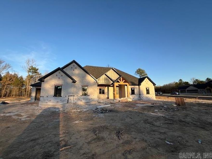 This one has fantastic curb appeal! This home is located in a brand new subdivision in Greenbrier. It has a very large backyard with trees to buffer the view of the neighboring homes. Inside the home you will find high ceilings and large windows. Abundant cabinetry with a hidden pantry with shelving for all the items that you don't want to be seen on your countertops. Quartz countertops throughout the home. Enjoy the view from the living room into the backyard while sitting in front of the cozy fireplace. Coming in from the garage is a half bath with lockers for coats, shoes and bags. You can circle through the laundry room into the primary closet through the bathroom and into the bedroom. You will enjoy the soaking tub and separate shower. By the way, the closet is massive. You will appreciate the storage in this home! Make this home a must see!