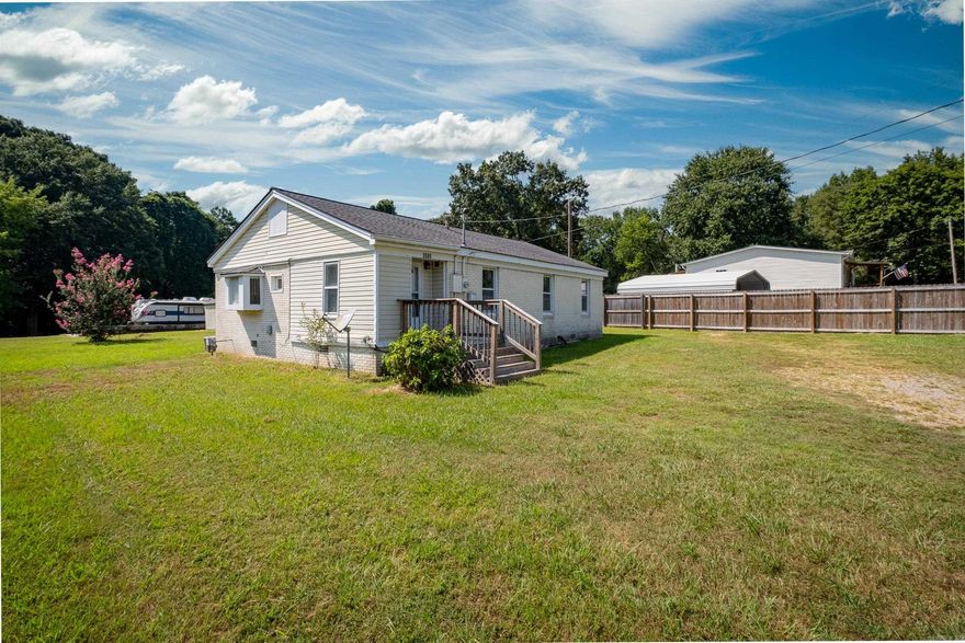Adorable 3-bedroom 1 bath home that is move-in ready. New floors, oven, and dishwasher. Large bathroom has been completely updated. The main bedroom is large and has room for an office or sitting area. 2 additional bedrooms. Separate laundry/mudroom. Covered carport, covered outdoor pavilion and 2 storage sheds. Located on nearly ½ acre corner lot in Benton School District. Home to be sold AS-IS. Agents please see remarks.