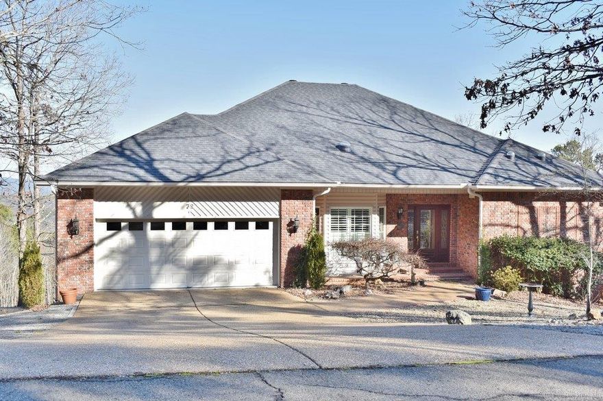 Motivated seller Beautiful home w/ Breathtaking view of Mountains & lakes. Custom-built home features an airy tall ceiling living room thru an elegant front entrance; Hickory hardwood floor, recess lighting, cozy gas-log fireplace; complimented by a refreshing view as back drop through the new Anderson picture windows.  Desirable gourmet kitchen w/ granite counter, breakfast bar, kitchen desk, dining area & access to the sundeck. Formal Dining room can be converted to a multi-purpose room or Guest BR on the main level. Principal BR suite + a private office/sitting room to enjoy your 'Me' time during the day. Comfortable bathroom w/ separate vanities & closets; make-up area for the lady, relaxing soaking tub & a fully tiled step-in shower w/ sprayers from both walls. Partial covered sundeck provides a cool area to enjoy nature & open area for outdoor living. Lower level w/2 guest Bdrms & sitting areas, full bath & a walk-out covered patio provides private accommodation for family & friends. Other updated features include new efficient solar pipes, 2 A/C units for upper & lower levels, new carpet in guest BR, water heater, new exterior door handle & locks, more.. See Agent remarks.