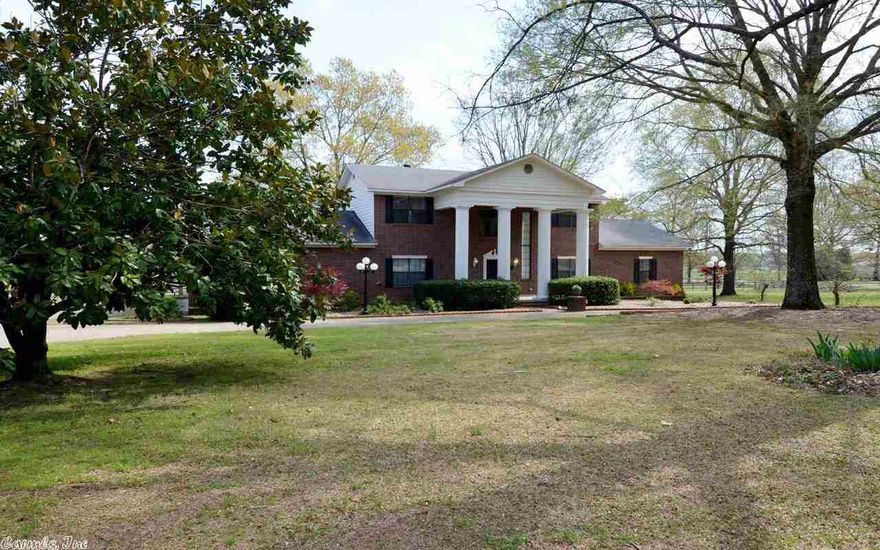 Stunning!!! True Southern Charm!! You will be charmed when you step inside. The dramatic two story entry will certainly impress. The beautiful kitchen/ custom cabinets & gorgeous granite will please the chef in the family. Entertain in the formal areas. Master downstairs/awesome bath. Very spacious great room with fireplace. Work at home in your office. Upstairs you will find two bedrooms & a bonus room.  Walk out to a covered patio overlooking the peaceful pasture land. Dad will love the 30 x 50 shop.