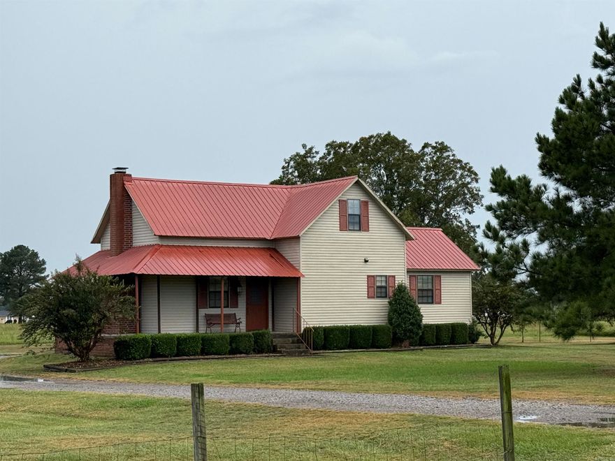 Beautiful 1,700± sq. ft. home on 10± acres near Scranton, AR—less than 1 mile from the Arkansas River and Lake Dardanelle! Features 2 bedrooms, 2 baths, and potential for a 3rd bedroom upstairs. Enjoy Mount Magazine views, wrap-around porch, Country Flame fireplace, garage/workshop combo, new carport, and fenced pasture for livestock. Peaceful rural setting with quick access to fishing, boating, and outdoor fun!
