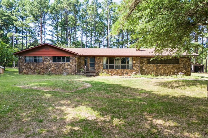 **Charming 3-Bedroom Home on 3 Acres with Country Appeal**  Welcome to your dream home! This beautifully maintained 1,808 sq. ft. residence features 3 spacious bedrooms and 2 bathrooms, offering plenty of space for family and guests. Nestled on a generous 3-acre lot, this property combines the convenience of city living with the tranquility of country life.  Step outside to discover a fenced backyard, perfect for entertaining or simply enjoying nature. You’ll find a bounty of fruit trees, including grapes, a peach tree, and an apple tree, providing delicious treats right in your own backyard.   The home boasts a two-car garage, a shed with electric, making it ideal for hobbies or extra storage. Recent updates include a new roof installed within the last five years and an HVAC unit replaced just three years ago, ensuring comfort and peace of mind.  Additionally, the property has a current termite contract, adding an extra layer of security. Also to the west of the home is a storm shelter.  Don’t miss out on this unique opportunity to own a well-maintained home that is waiting for your special touch. Sellers will not be doing any buyer requested repairs.