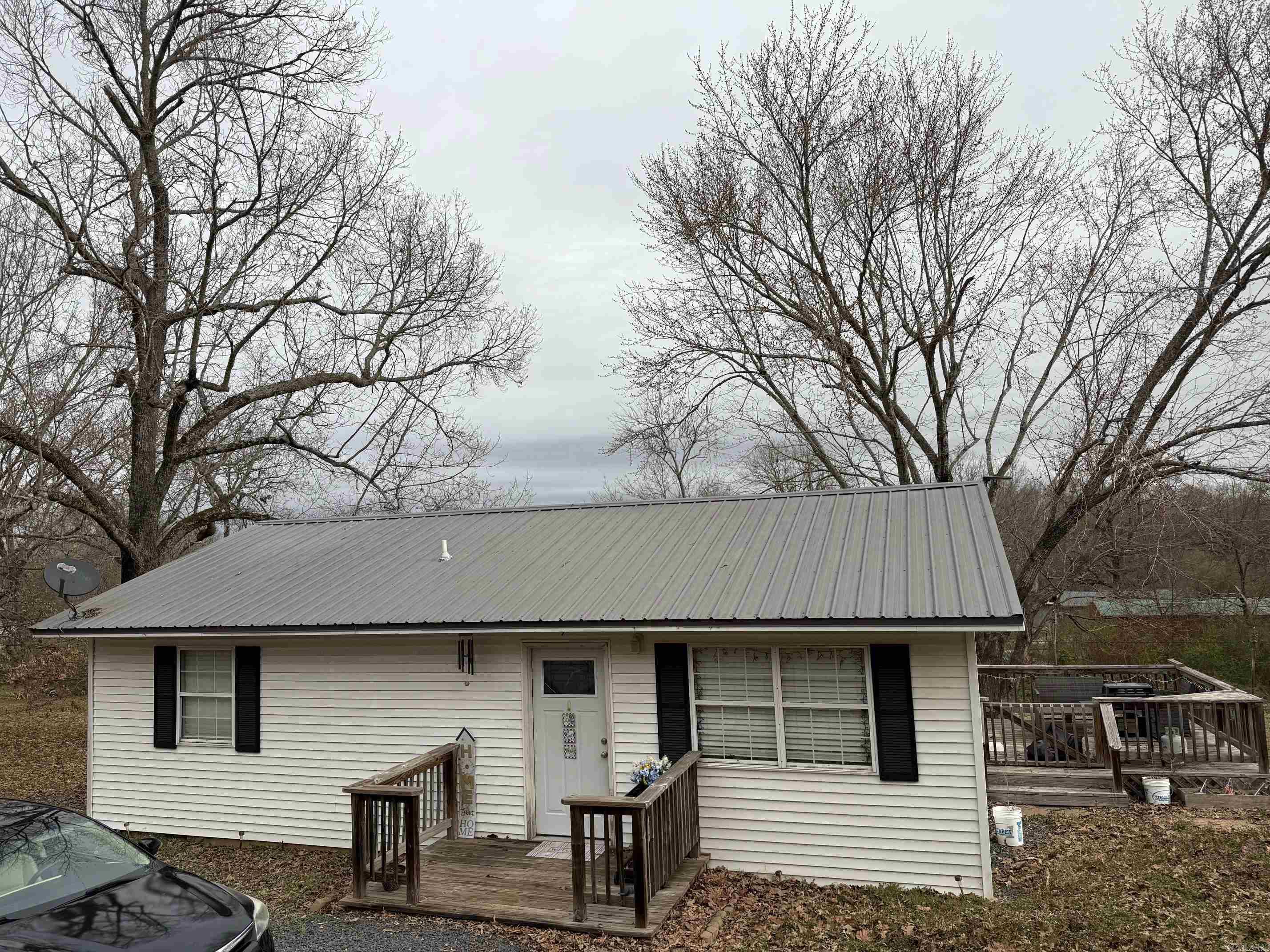 Recently renovated 2 bedroom 1 bath home on approximately .50 Acres!!! Updates include new HVAC, waterproof LVP, new cabinets, new countertops, stainless steel appliances, new vanities,toilet, water heater, deck, metal roof and so much more!!! AGENTS SEE REMARKS