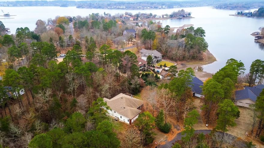 Common to Lake Balboa! Lake views from the Living areas and Kitchen. When you walk in, there is a living area to your right. Continue down the hall and there is a 2nd living area off the kitchen. Both living areas have a 2-sided fireplace. Formal dining room off the kitchen. Main level has Primary bedroom, sunroom and primary bathroom, Laundry room and half bath. Lower level has a living area, 2 bedrooms, 2 bathrooms and a sunroom/screened porch. Bonus is the Very Large Heated and Cooled Workshop! Ideal for many different Hobbies (wood working, train collector or quilting are just a few ideas). Bonus room that could be used as a 4th bedroom or Office. Back yard is partially fenced on either side of the sunroom. Recommend confirming the actual sq footage. New property owners to HSV will pay a One-time POA buy-in fee of $2,000. at closing. No Sellers Disclosure available.