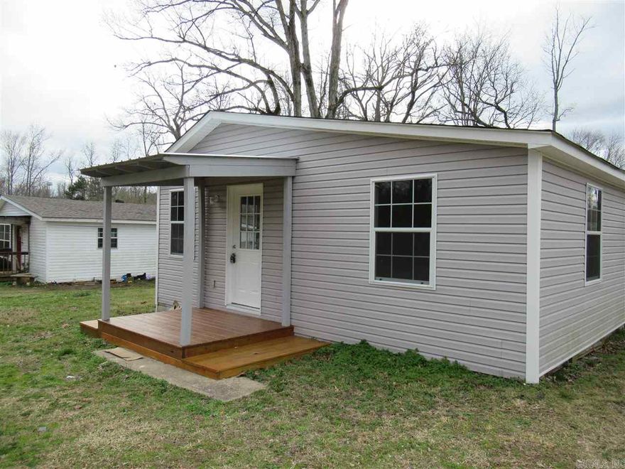 Home has been totally remodeled; Neutral colors; LRM; Kitchen; 2 BDRMS with 2 BTHS;Appliances have been put in for you as well;Large back yard; Deck and Front porch; Country yet close by to town. move in Ready!!!