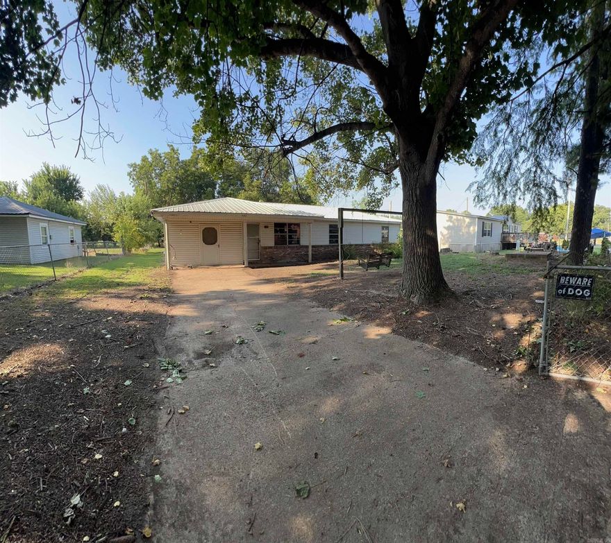 Located in Duncans 4th Addition, this 3-bedroom, 1-bath, 1,208 sq. ft. home offers an incredible investment opportunity for a savvy buyer. Built in 1962 on a solid concrete slab, it features a metal roof, low-maintenance vinyl siding, and a fenced yard.The carport has been enclosed, adding an extra room for flexible use. A dry year-round storm cellar provides peace of mind during severe weather. While the home is in need of a full renovation, the layout and structure make it a great candidate for a complete flip or rental property. Swifton is a quiet, friendly community with convenient access to local amenities, making this property a solid long-term investment. Bring your vision and turn this blank canvas into something truly special.