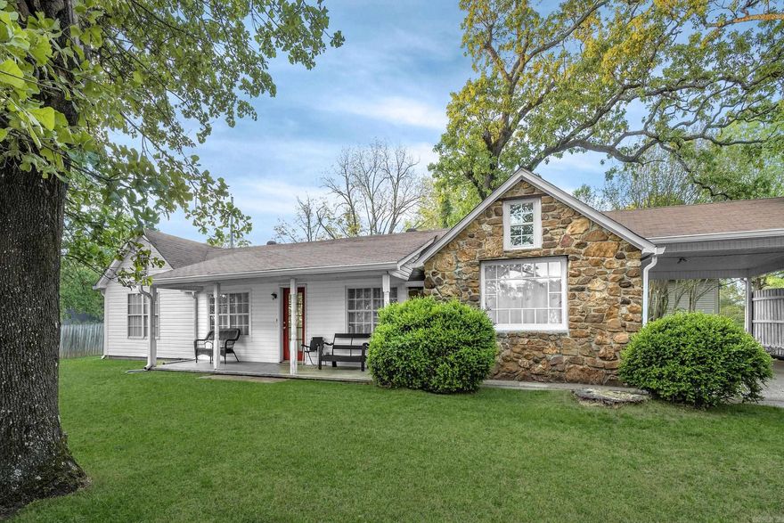 SELLER WILL GIVE A $13,000 ALLOWANCE FOR UPGRADES at closing with an acceptable contract. Call agent for details. Historic Sherwood cottage is so charming! One level with approx. 1297 SF and an additional 97 sf room with a window that can be a closet/office/bonus space. Native rock and siding exterior. Original home was built in 1930 with primary bedroom and bath added later.  Circular drive with a carport welcomes you to the home with the front covered porch on the side giving you extra privacy to enjoy.  Bright kitchen with a vaulted ceiling, island and an eat-in area. Kitchen refrigerator washer and dryer convey.  Laundry room. Cozy den.  Primary bedroom with a large closet and an ensuite bathroom.  2nd bedroom with a walk-in closet. Bathroom off the den.  Partially fenced area in the back with a brand new shed (2023).  2 Hot water heaters.  Other updates include new LVP floor (2025), microwave (2025), gutters (2021),washer and dryer (2020) new toilet in primary bath, all new faucets, and new smart thermostat. Lots of Character!