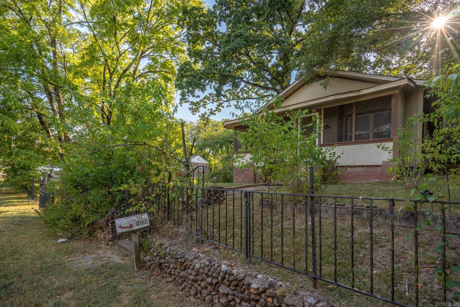 Beautifully updated home in the heart of the city just 3 minutes to Oaklawn Racing & Casino, CHI Hosp and unlimited dining and shopping options. You will fall in love with the fully fenced yard that provides a sense of security. The screen front porch is the perfecting setting for a porch swing day bed on one end and a seating area for a glass of sweat tea while you relax the day away. Open the front door to your new home with restored original hardwood flooring, freshly painted walls, base boards and ceilings. The large living room has room for your family gatherings or a quiet evening at home for movie night. The open kitchen is great as a neat in kitchen or add the perfect island with added seating since everybody ends up visiting over the snack trays. Formal dinner party? No problem! Your separate dining room features tasteful modern fixtures and lots of natural lights. The kitchen offers direct access to the back yard patio and grill central. After all, tail gate and fire pit season is just around the corner. Can you imagine spending your fall weekends outside in your own piece of paradise? The back yard stretches over several lots so you have room for additional outdoor...