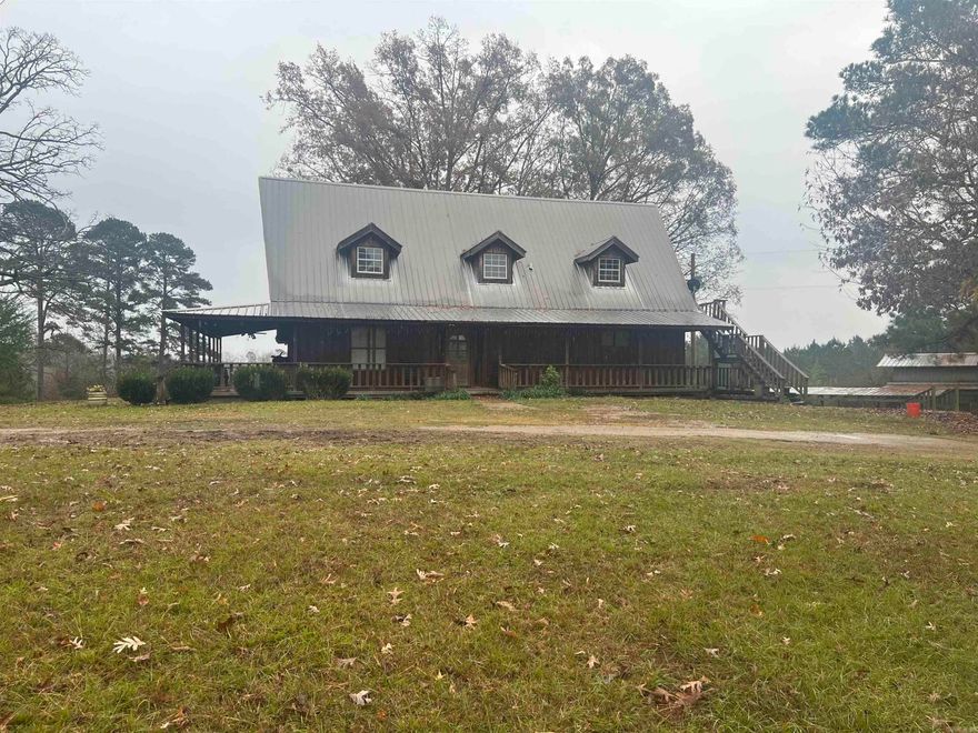 Looking for a peaceful retreat! This Charming Cedar Cabin has all the amenities you are looking for! Wrap around porch on 3/4 of the house. Has a back deck that overlooks the pond, you get to own part of the pond where you can fish when you feel like it.  Wood fire place for those cold nights! Barn/ shop for your projects. Vaulted ceilings make this house look modern with a few touches and a little elbow grease you can turn this property into a beautiful Home! Schedule a showing today!