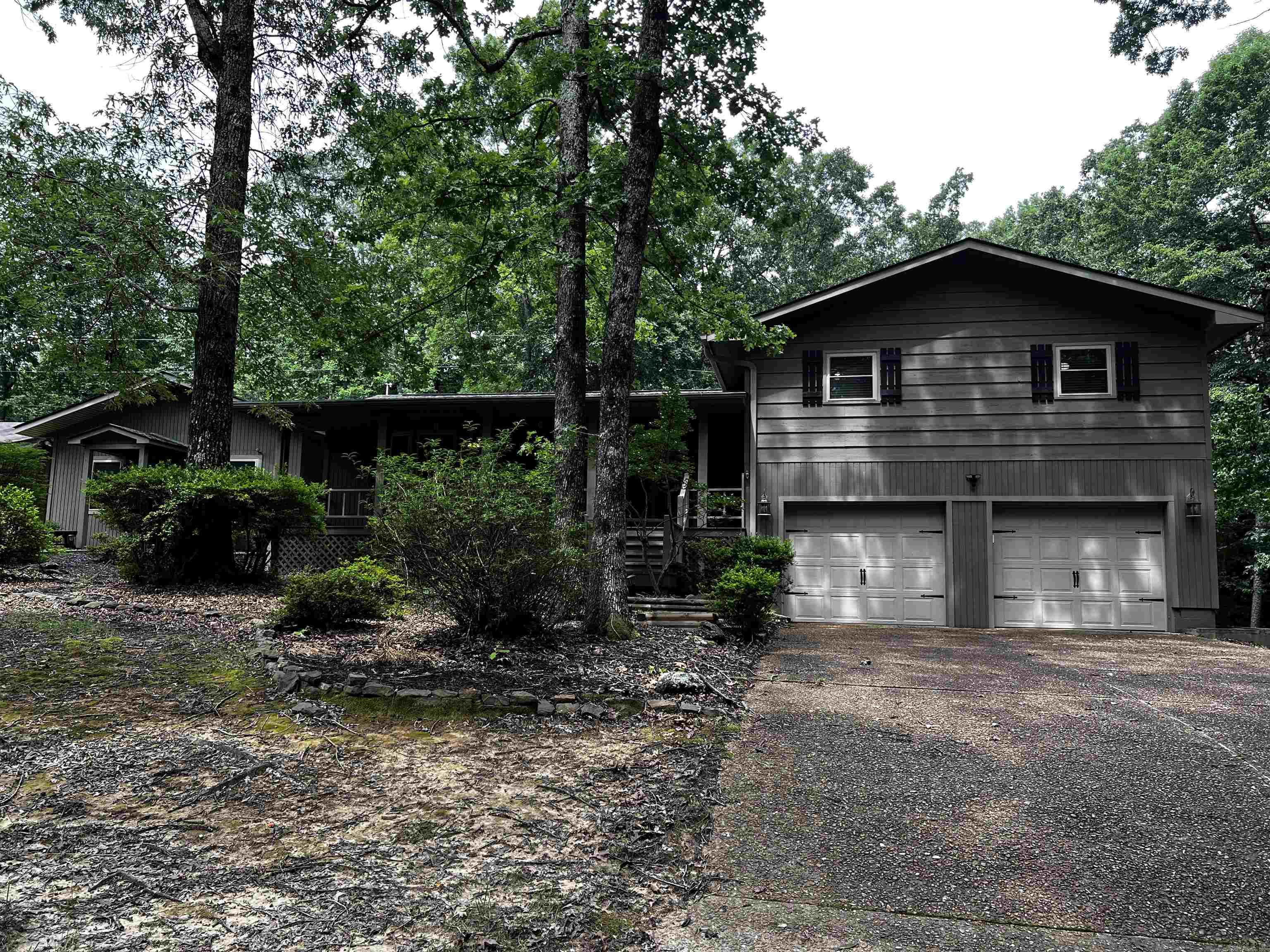 Updated home with separate living quarters located near the south shore of Greers Ferry Lake, community lake access, property has a 3 bed room 2 bath main residence of 1600 sf with large private back deck to gather and grill on, stone fireplace with gas logs that serves as the centerpiece of the great room. Kitchen was updated in 2024 with granite counter tops and new stainless appliances, living quarters is approximately 805 sf and could serve as in-law quarters or bunkhouse, game room, home office or man cave. Complete with its own entrance, kitchen, large bedroom & full bathroom, home has a kohler whole house generator and area for small garden, all on just under 3 acres