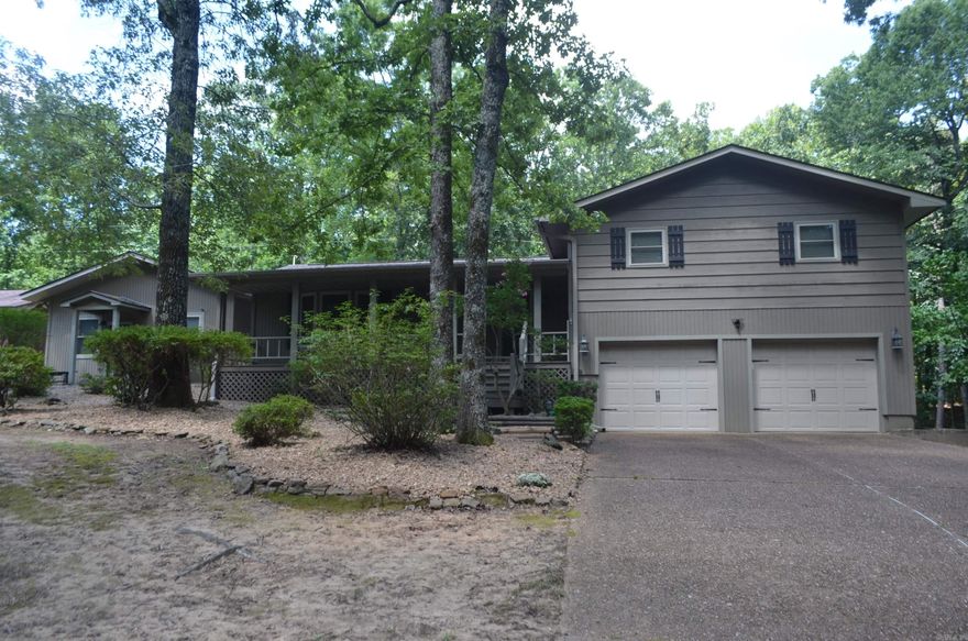 Updated home with separate living quarters located near the south shore of Greers Ferry Lake, community lake access, property has a 3 bed room 2 bath main residence of 1600 sf with large private back deck to gather and grill on, stone fireplace with gas logs that serves as the centerpiece of the great room. Kitchen was updated in 2024 with granite counter tops and new stainless appliances, living quarters is approximately 805 sf and could serve as in-law quarters or bunkhouse, game room, home office or man cave. Complete with its own entrance, kitchen, large bedroom & full bathroom, home has a kohler whole house generator and area for small garden, all on just under 3 acres
