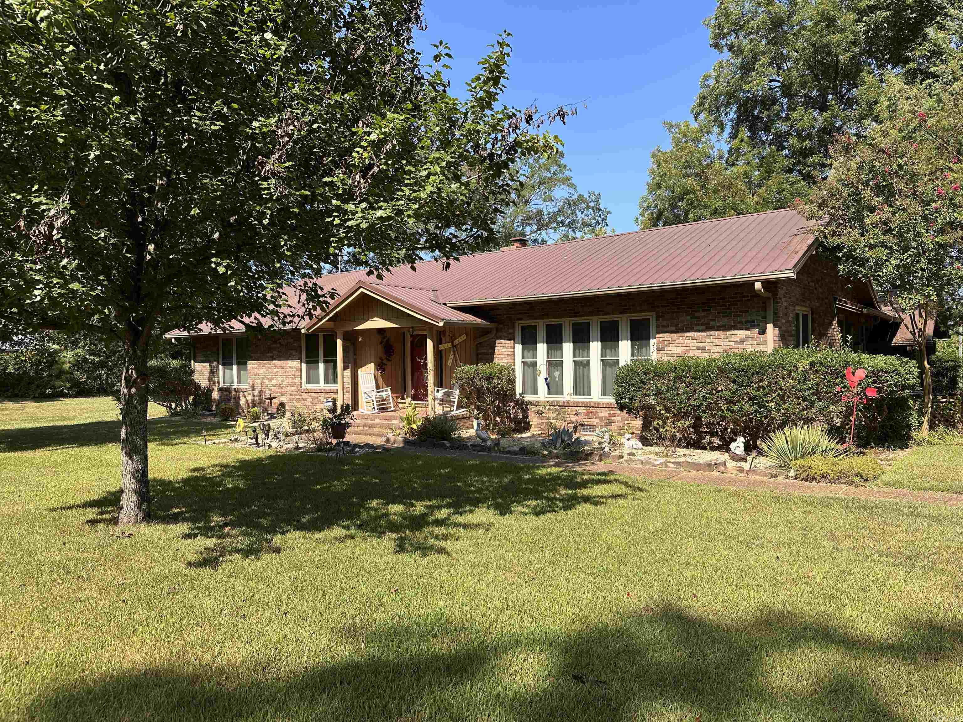 This is a well maintained home on a large lot. When you walk-in the front door you are greeted with a warm and welcoming living/dining room combination. As you continue through the house you enter a large family room with plenty of built-ins and a view of the large backyard. The kitchen has granite countertops and white cabinets plus a breakfast area. Off the kitchen is the laundry area with a small office. Each bedroom is spacious with walk-in closets. The master bedroom has an in suite bath with granite countertops, walk-in shower and big walk-in closet. Outside you have a large lot with two buildings. One is a detached 2 car garage with workshop area and the other can be converted into an apartment or leave it as is which can easily be another workshop or man cave. There is also a Generac generator. The refrigerator, washer/dryer and some furniture stays with the house.