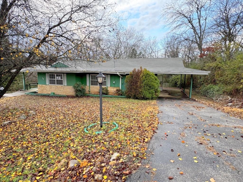 Roomy--over 1500 sq. ft.-- 2 bedroom 2 bath home with 2 carports.  The living room has a stone fireplace with a gas heater. Central HVAC-condition unknown.  House has potential for being a good rental or a permanent home with some updating.  Location is close to lakes and the North Golf Course.  Property sold as is. Note the following conditions: Priority to be given to Owner Occupant  Buyers, Eligible Nonprofit Organizations, and government entities until 1/19/25 .The seller does not accept blind offers or escalation clauses.  Cash buyers require 10% EMD or $1,000 minimum, whichever is greater, and all financed owners require  1% EMD or $1,000 minimum, whichever is greater.”