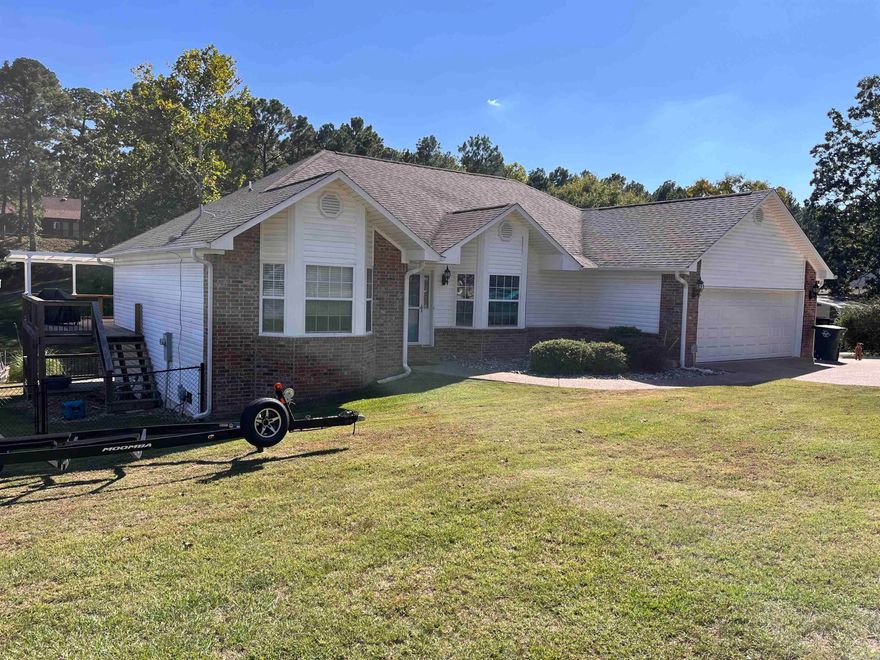 Take advantage of lake living on beautiful Lake Hamilton with this 3 br, 2.5 bath home and all the conveniences of living on one floor. This home boasts a covered deck, a boat slip with a lift and a gourmet kitchen. All the bedrooms are on the main floor for convenience, including a huge master suite with an attached office area and updated master bath. Finish it off with a covered carport, two car garage and a storage shed. All this in the much desired Lakeside School District, this is the perfect home for active family.