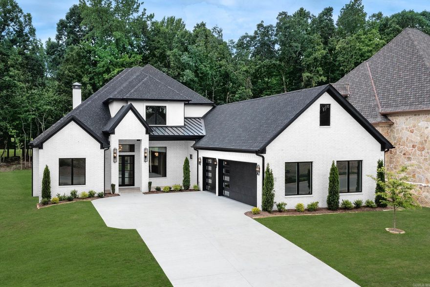 Stunning new construction luxury home in Miramont, Chenal’s newest & final neighborhood offering golf-front lots on Chenal CC Bear Den Course. This exceptional, energy-efficient home truly has everything. Beautiful chef’s kitchen features an oversized island, quartzite counters, ice maker, pot filler, eat-in area, gas range, double ovens, & opens to a butler’s pantry w/ bar sink & wine cooler. An incredible prep kitchen w/ a 2nd dishwasher, sink, extensive cabinetry & space for a 2nd refrigerator. Main level includes formal dining area, luxurious primary suite w/ 2 closets, 2 additional ensuite bedrooms, & office/study w/ a powder bath. Outdoors, enjoy an oversized entertaining space with outdoor kitchen, fireplace, heater, & sweeping golf-course views. Upstairs there is a 2nd laundry room, spacious media/game room w/a wet bar & beverage cooler, plus upper balcony overlooking the course. Additional features include smart-home technology, EV charger outlet, smart sprinkler system, custom epoxy garage floors, complete home network w/ Cat6 Ethernet, & hardwood floors. A rare opportunity to own a home in one of Chenal’s most exclusive gated neighborhoods. Virtually Staged.