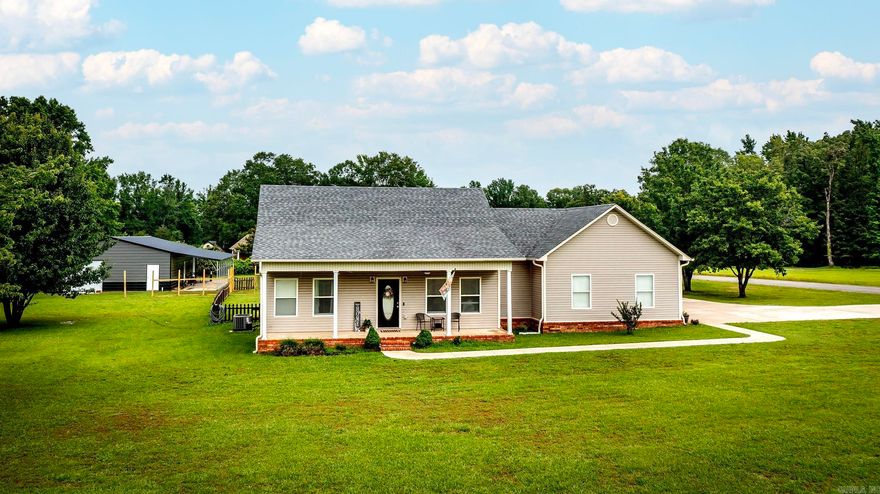Welcome to your ideal blend of country charm and modern convenience! This spacious 4-bedroom, 2-bath home sits on a beautifully maintained 1.36-acre lot in a quiet, friendly neighborhood just minutes from town. Enjoy the best of both worlds – the peace and privacy of rural living without being too far from amenities.  The home features a desirable split floor plan, offering privacy for the primary suite, and a large kitchen that's perfect for cooking, entertaining, or gathering with family. Step out onto the back porch with your morning coffee and take in the tranquil surroundings – it's the perfect spot to start your day.  You'll love the brand-new large shop with a lean-to, perfect for projects, storage, or a home-based business. There’s also extra parking for your RV, boat, or guests, and a fully fenced backyard, great for kids, pets, or outdoor entertaining.  Whether you're looking for a family home, a peaceful retreat, or a place with room to grow, this property has it all. Don’t miss out on this rare find in a great neighborhood!