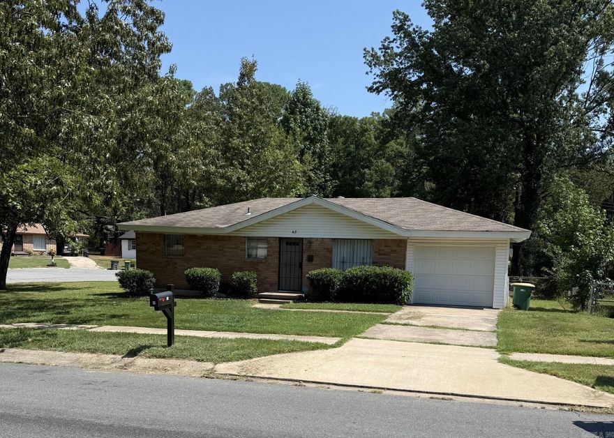 Nice corner lot with 3 bedrooms and one and a half baths, enclosed garage with laundry and storage.  Great back yard with side access to culdesac.  Security door at front.  Has been great investment property with good history, tenants have moved out for owner occupied or new investor.  Gas stove. Carpet, wood, and vinyl floors, updated baths.  Nice grass and shade trees.  Come check out a great opportunity.