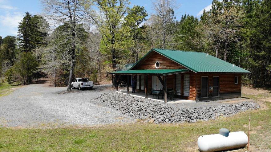 Great cabin with lake and privacy, has 2 beds, 1.5 bath, living room dining room and kitchen combination, heat with back up, covered front porch, insulated and heated well house. car port, cabin is fully furnished. Fiberoptic enter net service. one of the beds is a closed in bed in living area.