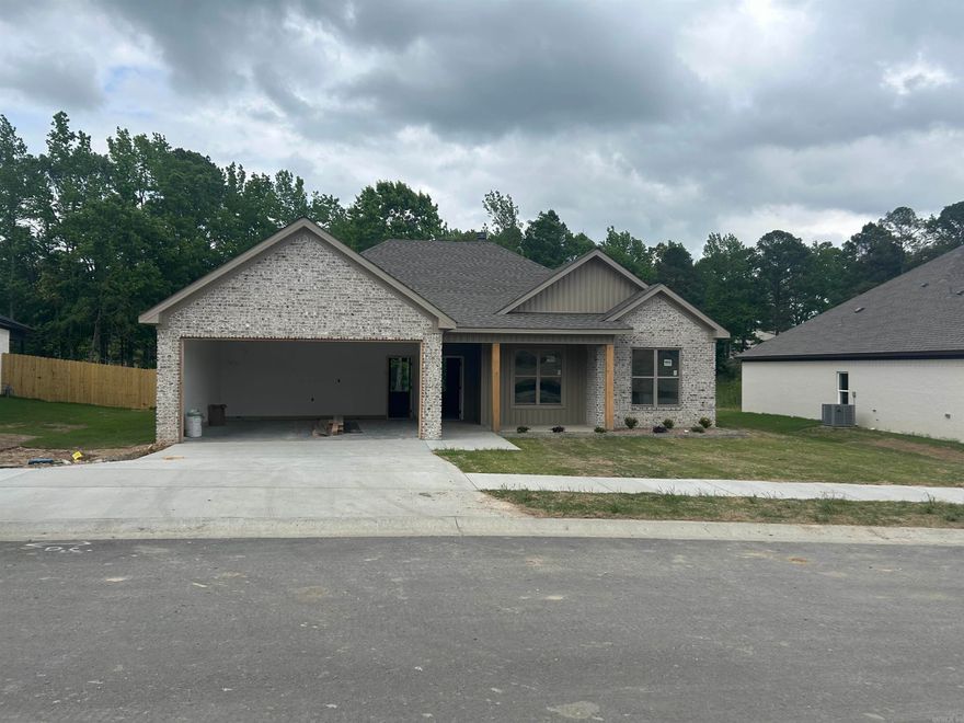 New Construction Home with all brick exterior on spacious lot inside city limits. Three full baths including a guest bedroom with its own bathroom. Energy efficient windows and foam insulation. Large picture windows in dining area and living room. Covered front and back porches.