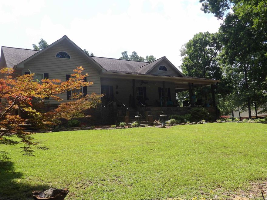 THIS  IMMACULATE 2/3 BEDROOMS, 1,900' OF LIVING AREA, SPACIOUS GREAT ROOM WITH FIREPLACE, BUILT-INS, BEAUTIFUL KITCHEN WITH BREAKFAST BAR AREA, DETACHED GARAGE WITH ROOM UPSTAIRS, 2 METAL STORAGE BUILDINGS, BEAUTIFUL LANDSCAPING SURROUNDS HOME, WRAP AROUND PORCH, LARGE PATIO AREA, CIRCULAR PAVED DRIVEWAY. THIS IS A MUST-SEE!!