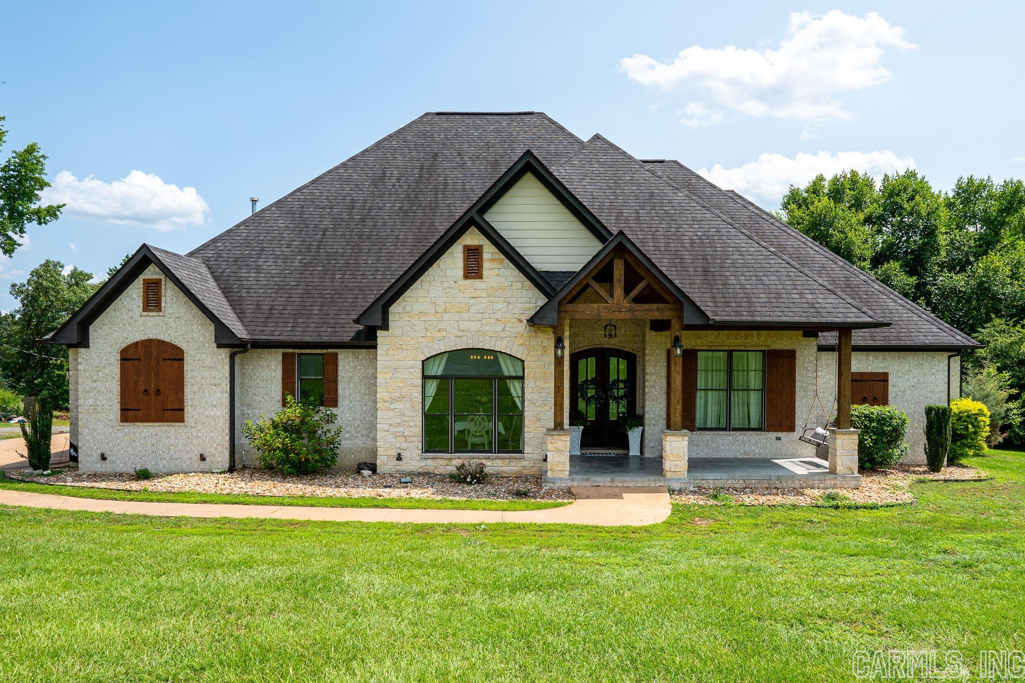 Beautiful custom built home on almost five acres, with a gated drive. This house has so many up grades and features. Custom kitchen with upgraded appliances. Property has a huge shop and an a 2 bed one bath office/apartment that can be used as a mother in laws quarters. The beautiful acreage also has a large pond. 3 car garage and an abundance of storage. Huge bonus room that can be used as a media room. Large covered patio with a wood burning firaplace. Must see to appreciate all this gorgeous home has to offer.