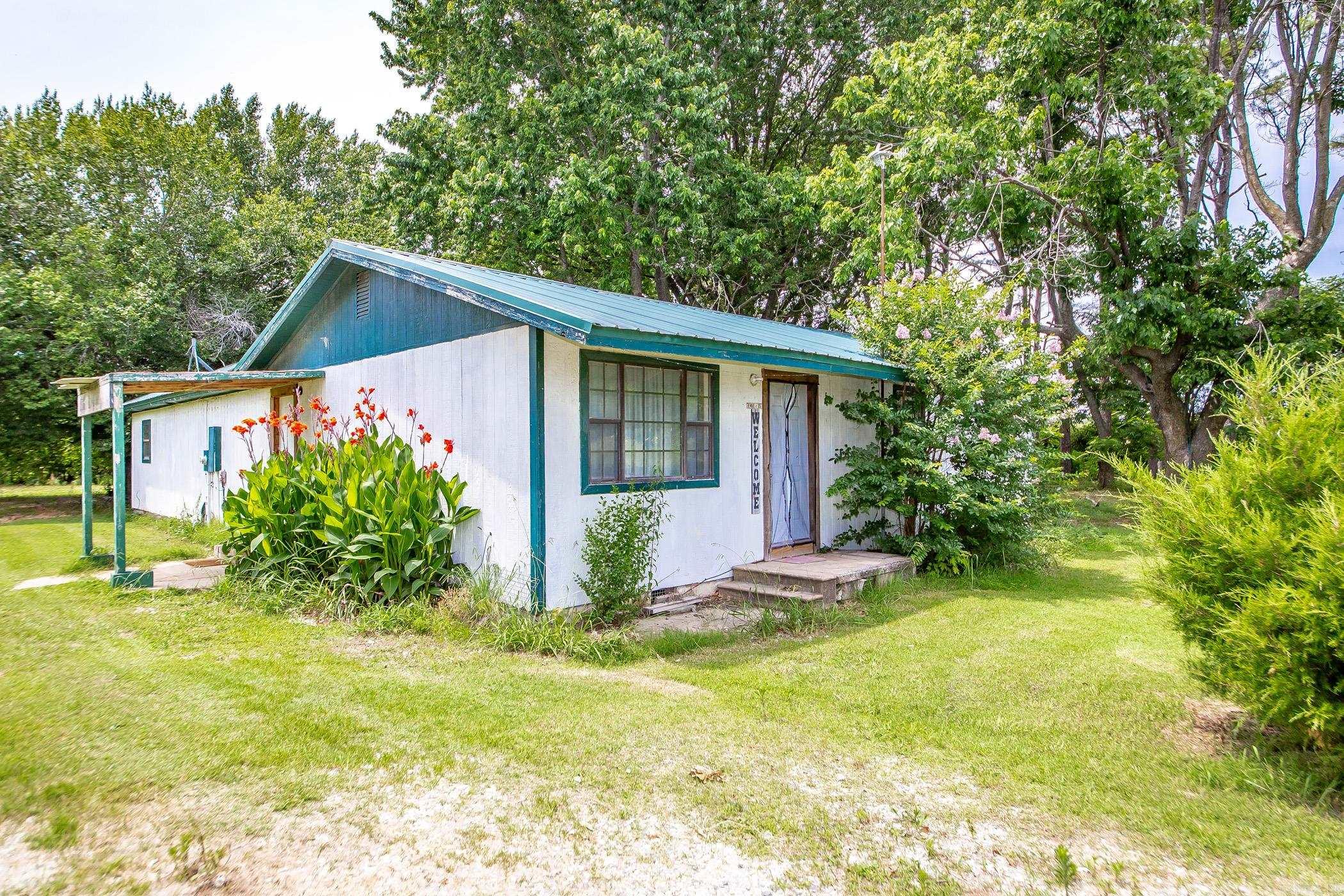 Charming Country Living - Endless Potential! Escape to the peace and quiet of the countryside with this cozy 3 bedroom gem, just waiting for the right owner to bring it back to life. Nestled on a spacious half acre lot and surrounded by nature, this fixer-upper offers the perfect opportunity to create your dream rural retreat or investment property. Featuring rustic charm, mature trees, and open skies, this home is a blank canvas with tons of potential. Whether you're looking to renovate for yourself or flip as a project, the serene setting makes it worth the effort. Don't miss your chance to own a piece of the country at an affordable price - opportunities like this don't last long!