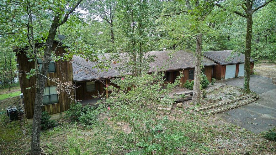 Discover the charm of 329 Rainwood Terrace—an inviting retreat nestled on 1.64 lush acres. With 5 spacious bedrooms and 4 well-appointed bathrooms spanning 2,588 sq. ft., this home offers abundant room for everyone to carve out their own sanctuary. The property boasts ample storage, including a versatile outdoor building that could transform into a cozy craft room, a whimsical kid’s playhouse, or even a stylish man cave. Plus, its convenient location just minutes from Lake Hamilton School ensures a seamless lifestyle. Welcome home!