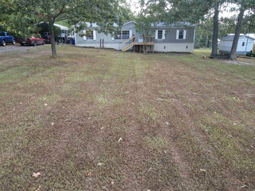 Well maintained Double Wide on a permanent foundation featuring 3 bedrooms, 2 bathrooms, and additional versatile rooms ideal for extra bedrooms or a home office. Situated on 1.91 acres, this property offers both space and flexibility! New HVAC 2023, NEW Roof July 2025!