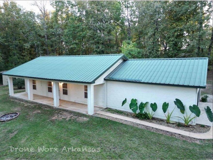 Country Home on 3.72 Acres Near South Fork of the Spring River – Unrestricted Land! Located along a county road, this 2-bedroom, 2-bathroom home is ideal for those seeking a peaceful North Arkansas country lifestyle, with room for a few animals, gardening, or hobby farming. This well-built steel-framed home, featuring a durable metal roof, boasts an open-concept living, kitchen, and dining area, highlighted by stylish concrete countertops and easy-care finishes. Both bathrooms offer walk-in showers, providing comfort and accessibility. The home is equipped with county water, private septic system, and a water softener, ensuring convenience and efficiency. An extra-large 2-car garage provides plenty of space for vehicles, tools, and storage, while the onsite shed adds even more flexibility for equipment or livestock supplies. With unrestricted land, you’ll have the freedom to build a shop, add fencing, raise animals, or simply enjoy wide-open space and privacy. Located just minutes from the South Fork of the Spring River, this property is perfect for those who enjoy fishing, kayaking, floating, and outdoor recreation, while still being easily accessible by county road.