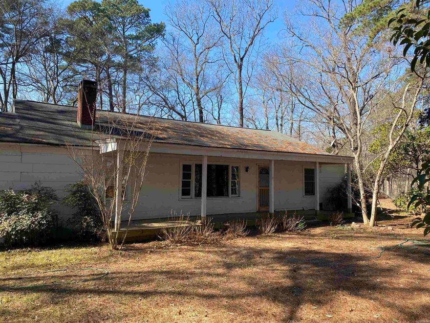 Charming 3 bed, 1 bath fixer-upper on approximately 4.79 of the prettiest acres in town! You, your people, pets and plants will LOVE hanging out in the light filled, open kitchen/dining space, or sitting on the screened in back porch taking in the beautiful views.  The front yard and part of the side and back yards are fully fenced.  Bring your imagination and turn this diamon in the rough into your own jewel!